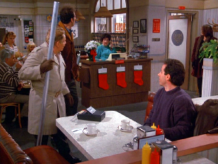 Festivus Screenshot fra TV serien "Seinfeld". Frank Constanza med aluminiumstangen som brukes som dekor under høytiden.